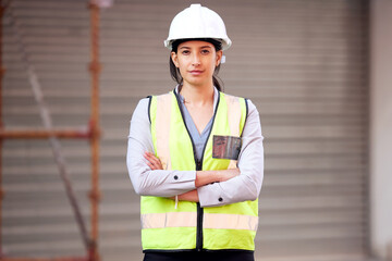 Sticker - Building this city with my own hands. Shot of a young woman working on a construction site.