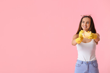 Wall Mural - Young woman with sponge on color background