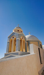 Wall Mural - Greek church with blue dome near the sea in Oia town, Santorini island, Greece