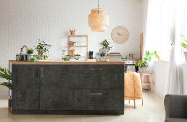 Canvas Print - Interior of modern kitchen with counters, houseplants and clock