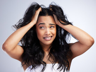 i cant deal with this today. shot of an attractive young woman standing alone in the studio and feel