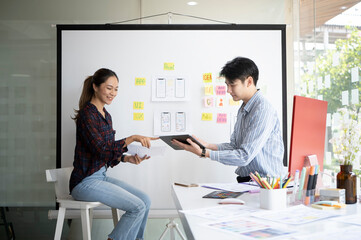 Wall Mural - website developer team brainstorming and discussing for mobile application software design project t