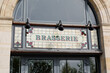 brasserie restaurant text sign paint on wall facade french building city street