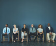 © Tamani Chithambo/peopleimages.com - Consider everything a test, even the possible extended 10-minute wait. Shot of a group of well-dressed business people seated in line while waiting to be interview.