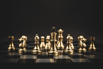 Close-up king chess standing on chessboard concepts of teamwork or volunteer or challenge of business team or wining and leadership strategy and organization risk management or team player.