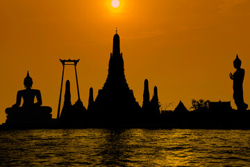 Wall Mural - Vesak day concept: silhouette wat arun tourist attraction in thailand.