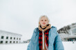 © bodnarphoto - Close portrait of a cute girl in warm casual clothes on a walk on a cold winter day, looking at the camera.