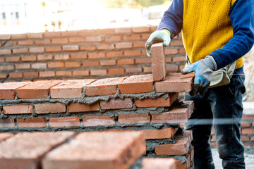 Close up of bricklayer building walls