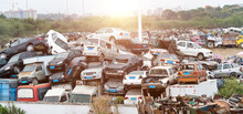 A Pile Of Abandoned Cars On Junkyard
