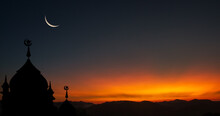 Silhouette Of A Mosque At Sunset With Crescent Moon On Dusk Sky In The Evening Religion Of Islamic In Ramadan Month, Eid Al Adha, Eid Al Fitr