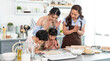 © NaMong Productions - Happy Asian family grandmother with mother and child making food in kitchen at home. Enjoy family activity together.