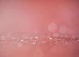  Grainy abstract bokeh background in coral pink