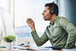 © K Seisa/peopleimages.com - He gives the best financial advice. Shot of a confident young businessman talking through a headset while being seated at his desk in the office.