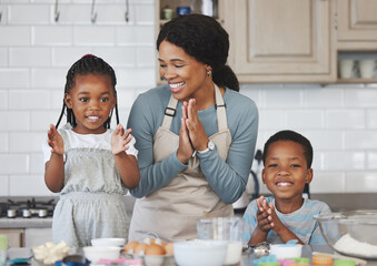 Canvas Print - Baking is like washing, the results are equally temporary. Shot of a mother baking with her children at home.