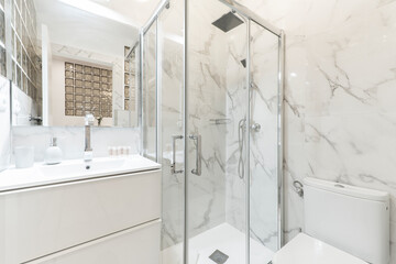 Wall Mural - Bathroom with porcelain sink, shower tray, rectangular frameless mirror and walls covered in white marble with gray veins