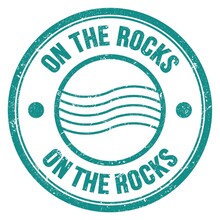 ON THE ROCKS Text Written On Blue Round Postal Stamp Sign