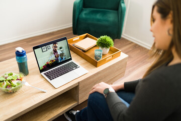 Wall Mural - Woman on a teleconference with a nutritionist