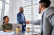 Are you ready to get started. Shot of two business people shaking hands during a meeting.
