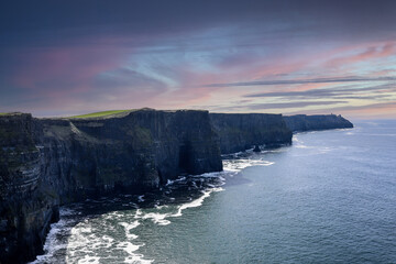 Wall Mural - The Cliffs of Moher are sea cliffs located at the southwestern edge of the Burren region in County Clare, Ireland