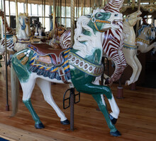 Green And White Carousel Horse Bedecked With Saddle And Tassels