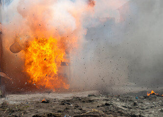 real explosion with fire smoke and dust in the street without people