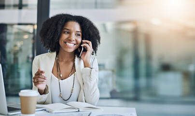 Aufkleber - Hearing great news is truly rewarding. Shot of a young businesswoman taking a phone call at her office desk.
