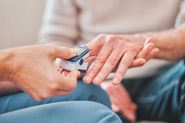 Canvas Print - Your symptoms seem to be easing up. Shot of a nurse checking the blood pressure of a mature patient.