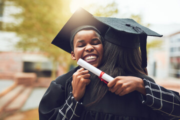 Poster - Our friendship got us through a lot of long nights. Shot of two graduates embracing each other on graduation day.