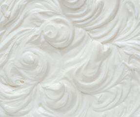  Creamy pics in yoghurt or cream surface. Top view.
