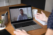 © fizkes - Unknown woman sits at table look at laptop screen have online conversation via conference with colleague. Communication, on-line counselling, remote job interview, long-distance relationships concept