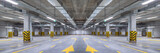 Fototapeta  - Empty shopping mall underground parking lot or garage interior with concrete stripe painted columns