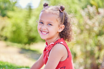 Sticker - Sunny days excite me. Shot of an adorable little girl spending time outdoors.