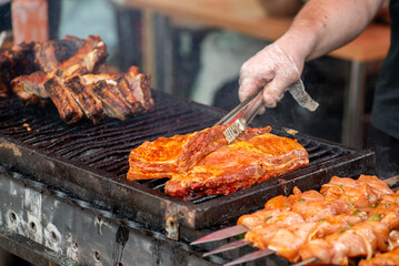 Wall Mural - Chef grill barbecue meat and ribs outdoors. BBQ meat