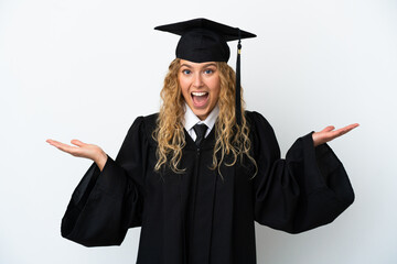 Wall Mural - Young university graduate isolated on white background with shocked facial expression