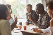 © yurolaitsalbert - young entrepreneurs discussing a joint project in the office of the coworking center.