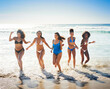 © Delmaine Donson/peopleimages.com - When the weathers warm, spend it in the water. Shot of a group of happy young women having fun together at the beach.