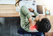 © K Seisa/peopleimages.com - This neck pain doest want to go away. High angle shot of an uncomfortable young businessman holding his neck in pain while being seated in the office during the day.