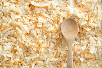 Wall Mural - toasted coconut flake with wooden spoon