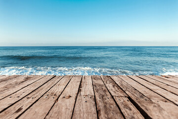 Wall Mural - Old boards, floor against the background of the blue sea and sky. The concept of vacation, travel, vacation, wallpaper.