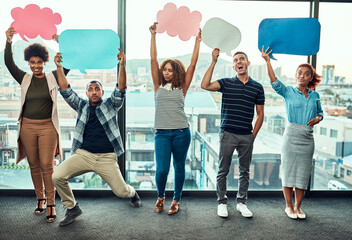 Aufkleber - Hold your sign up high. Portrait of a cheerful young group of work colleagues standing next to each other while holding up signs inside of the office during the day.