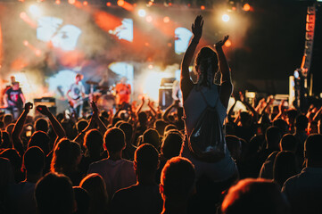 Sticker - Silhouette of a woman with raised hands on a concert