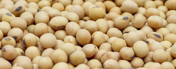 Close-up shot on a background of a pile of dried soybeans. for product advertisement