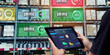 © panuwat - Smart Augmented Reality,AR warehouse management system.Worker hands holding tablet on blurred warehouse as background