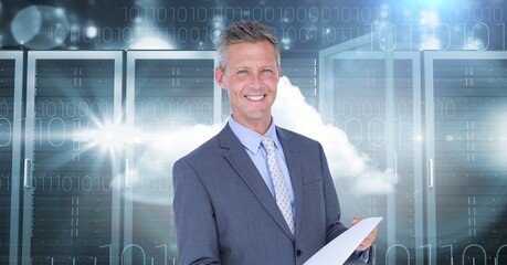 Poster - Portrait of caucasian businessman holding a document against against computer servers and clouds