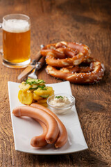 Wall Mural - closeup of frankfurter sausages on rustic wood