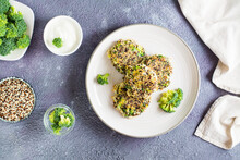 Fried Quinoa And Broccoli Mixture Pancakes On A Plate. Top View