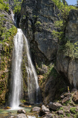 Wall Mural - Beautiful Theth waterfall near Theth village in Albanian alps mountains