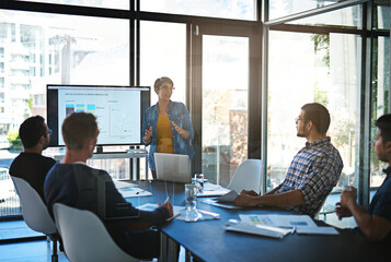 Poster - Well get there if we work together. Cropped shot of a young businesswoman giving a presentation in the boardroom.