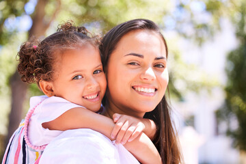 Poster - Lets go play mom. Shot of a mother giving her daughter a piggyback ride in the park.