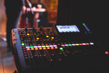 View Of Lighting Technician Operator Working On Mixing Console Workplace During Live Event Concert On Stage Show Broadcast, Light Mixer Controller Panel, Sound Technician With Professional Equipment